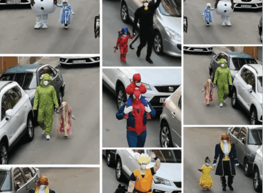 Pai e filha usam fantasias para levar lixo durante o isolamento na Espanha